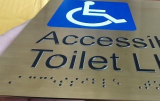 braille signs restroom